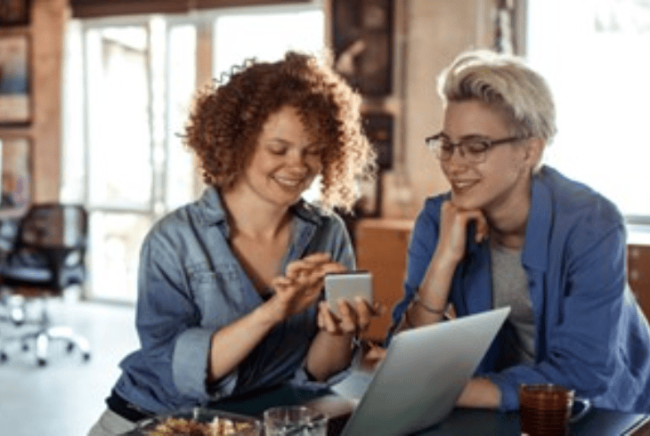 Two women working together